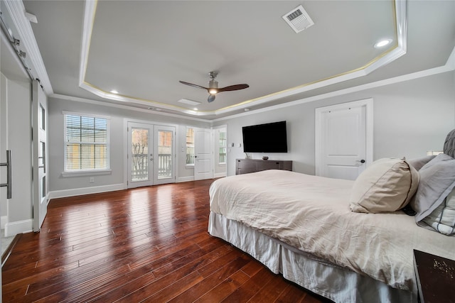 3327 Palm St, Houston, TX 77004 - bedroom featuring a tray ceiling, access to exterior, crown molding, hardwood / wood-style flooring, and recessed lighting