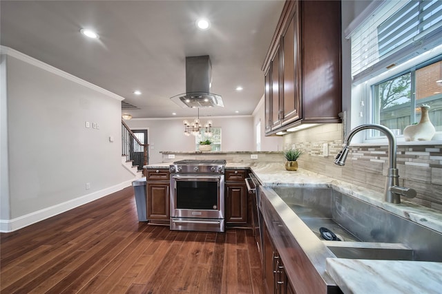 3327 Palm St, Houston, TX 77004 - kitchen featuring high end range, island range hood, a peninsula, crown molding, and dark wood-style floors