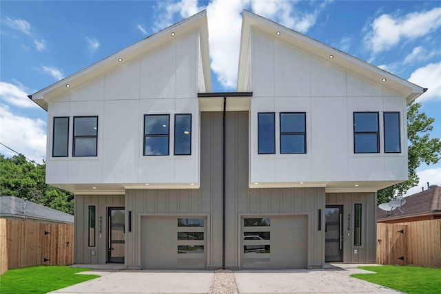 4505 Phlox St, Houston, TX 77051 - contemporary home with a garage, board and batten siding, concrete driveway, and a gate