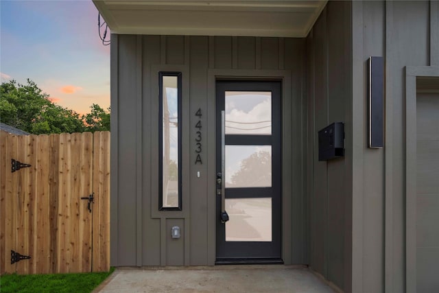 4505 Phlox St, Houston, TX 77051 - exterior entry at dusk with board and batten siding