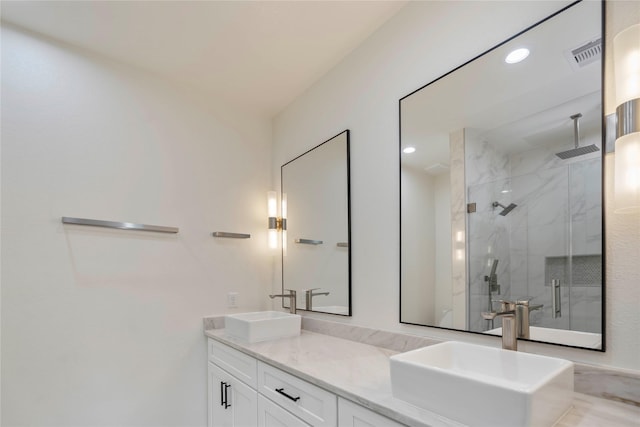 4505 Phlox St, Houston, TX 77051 - full bathroom featuring a marble finish shower, double vanity, and recessed lighting