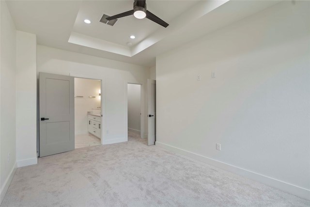 4505 Phlox St, Houston, TX 77051 - unfurnished bedroom featuring light colored carpet, recessed lighting, connected bathroom, a raised ceiling, and ceiling fan