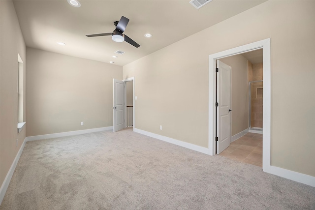 735 20th St, Hempstead, TX 77445 - unfurnished bedroom featuring light carpet, recessed lighting, ceiling fan, and ensuite bathroom