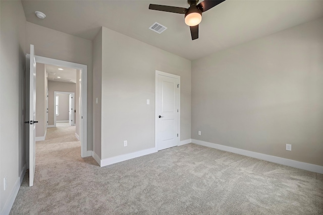 735 20th St, Hempstead, TX 77445 - unfurnished bedroom with light colored carpet and a ceiling fan