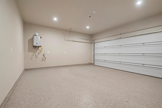 735 20th St, Hempstead, TX 77445 - garage with recessed lighting and water heater