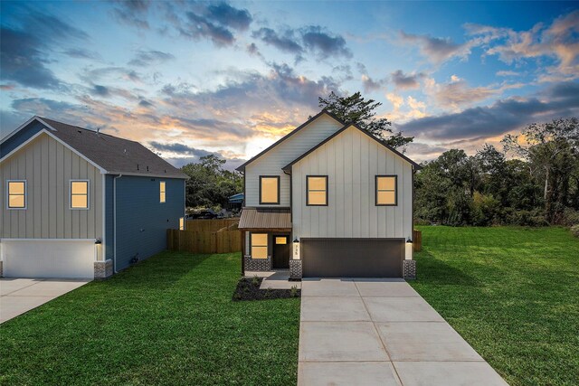 735 20th St, Hempstead, TX 77445 - view of front of property with an attached garage, board and batten siding, driveway, and stone siding
