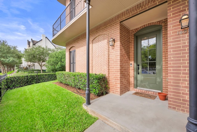 1801 Ashland St, Houston, TX 77008 - doorway to property with brick siding and a yard