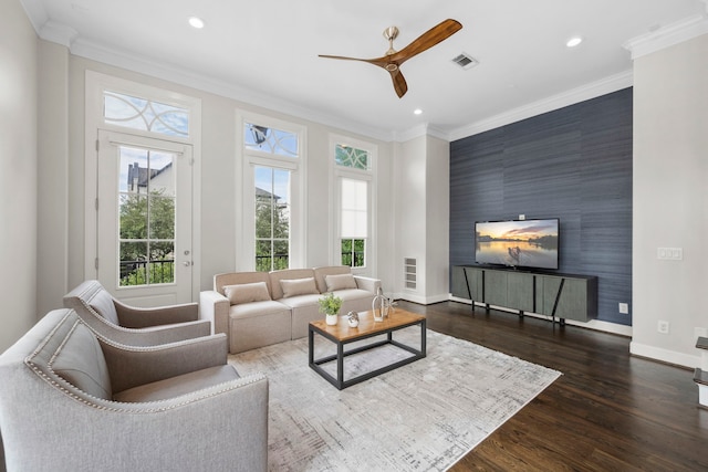 1801 Ashland St, Houston, TX 77008 - living room with an accent wall, recessed lighting, ceiling fan, dark wood-type flooring, and crown molding