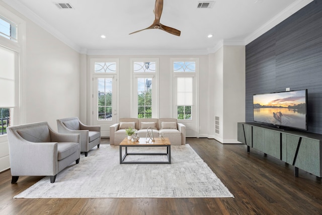 1801 Ashland St, Houston, TX 77008 - living area featuring an accent wall, recessed lighting, a ceiling fan, wood finished floors, and crown molding
