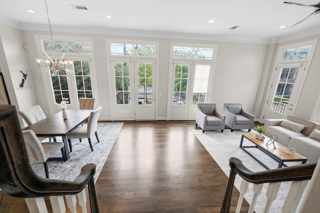 1801 Ashland St, Houston, TX 77008 - living room featuring crown molding, healthy amount of natural light, dark wood-style floors, recessed lighting, and a chandelier