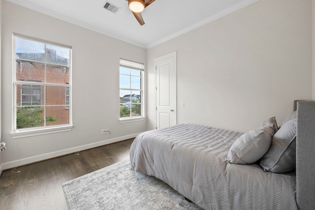 1801 Ashland St, Houston, TX 77008 - bedroom with wood finished floors, crown molding, and a ceiling fan