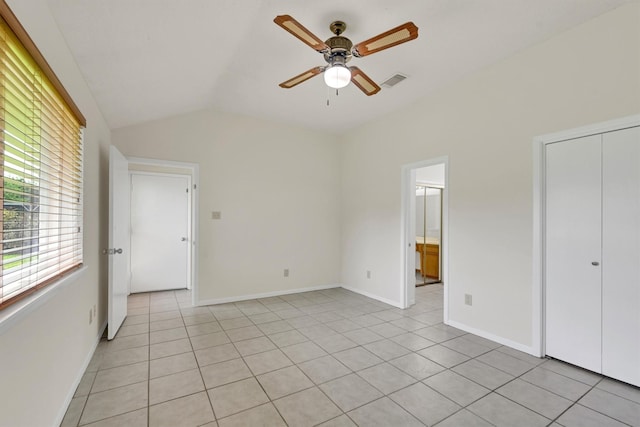 4418 Talina Way, Houston, TX 77041 - unfurnished bedroom with vaulted ceiling, light tile patterned floors, a ceiling fan, and ensuite bath