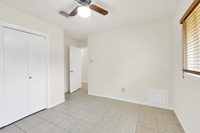 4418 Talina Way, Houston, TX 77041 - unfurnished bedroom with a closet, a ceiling fan, and light tile patterned floors