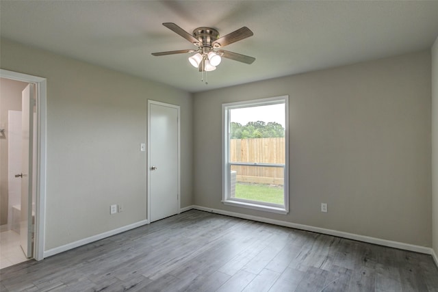3300 Pebblebrook Dr Unit 15, Seabrook, TX 77586 - spare room featuring ceiling fan and wood finished floors