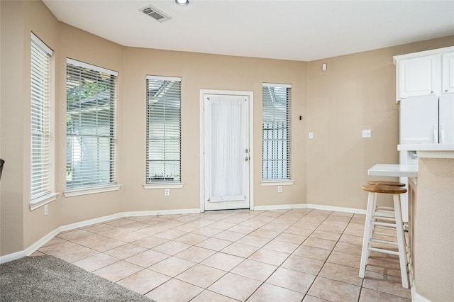 2603 Piney Woods Dr, Pearland, TX 77581 - foyer entrance featuring light tile patterned flooring and baseboards