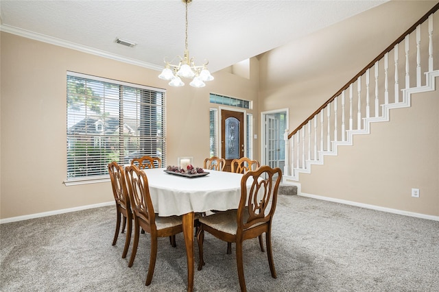 2603 Piney Woods Dr, Pearland, TX 77581 - carpeted dining area with a chandelier, crown molding, and stairway
