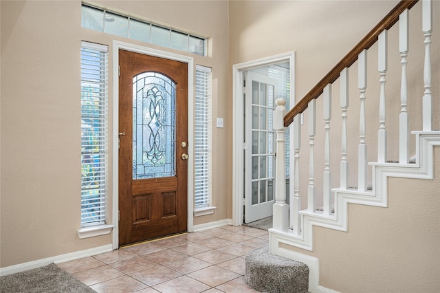 2603 Piney Woods Dr, Pearland, TX 77581 - foyer featuring stairs and light tile patterned floors