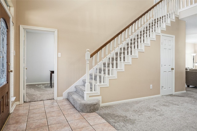 2603 Piney Woods Dr, Pearland, TX 77581 - tiled entryway with carpet and stairs