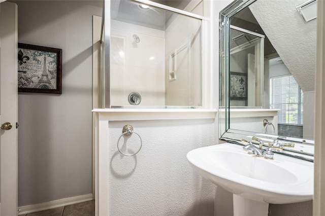 2603 Piney Woods Dr, Pearland, TX 77581 - bathroom featuring a shower and tile patterned floors