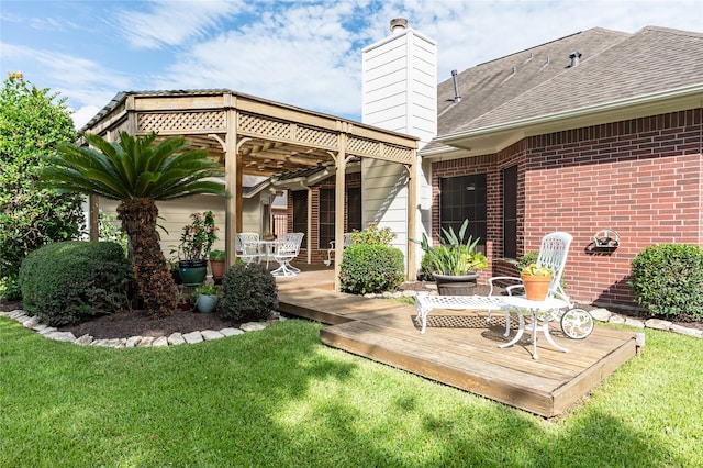2603 Piney Woods Dr, Pearland, TX 77581 - rear view of house featuring a wooden deck, a lawn, brick siding, and a chimney