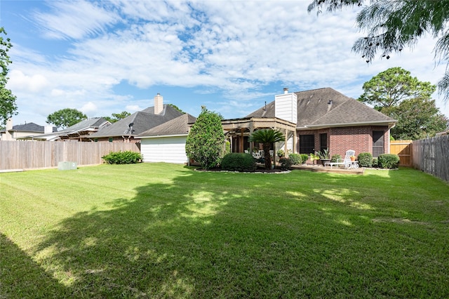 2603 Piney Woods Dr, Pearland, TX 77581 - back of property with a fenced backyard, a patio area, brick siding, and a chimney
