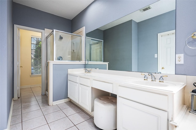2603 Piney Woods Dr, Pearland, TX 77581 - bathroom featuring a shower stall, double vanity, and tile patterned floors