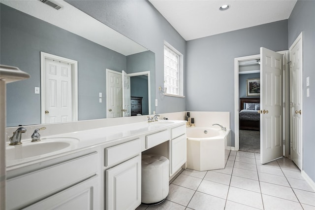 2603 Piney Woods Dr, Pearland, TX 77581 - full bath featuring ensuite bathroom, a garden tub, double vanity, and tile patterned floors