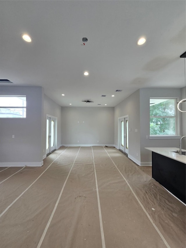 3404 Rawley St, Houston, TX 77020 - unfurnished living room featuring recessed lighting and plenty of natural light