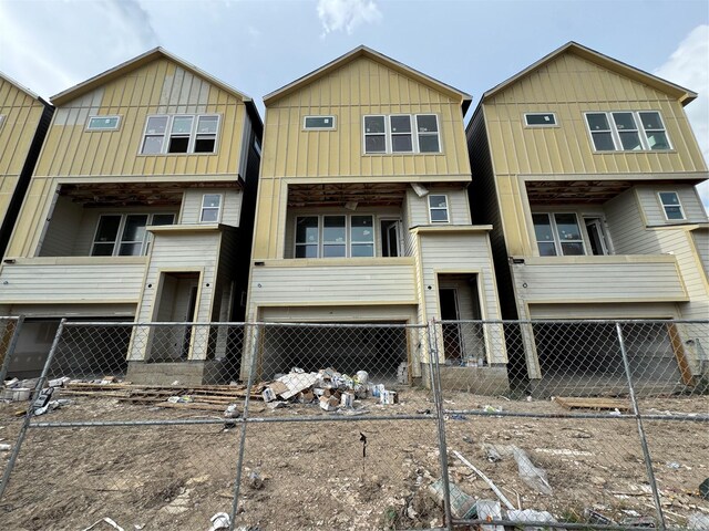 5107 Ave J, Houston, TX 77011 - view of front of house featuring board and batten siding and a balcony