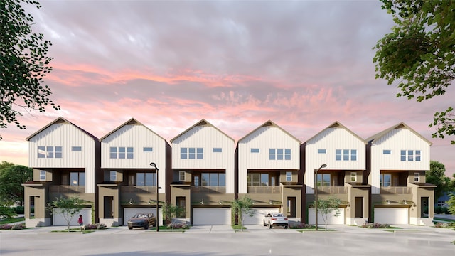 5107 Ave J, Houston, TX 77011 - townhome / multi-family property with board and batten siding and an attached garage