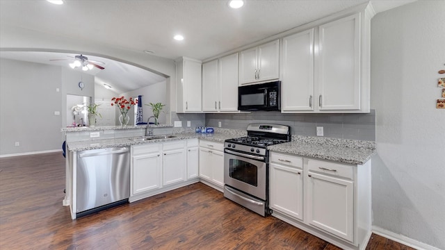 2319 Blue Reef Dr, Katy, TX 77449 - kitchen featuring stainless steel appliances, a ceiling fan, backsplash, white cabinetry, and a peninsula