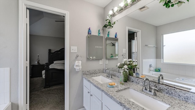 2319 Blue Reef Dr, Katy, TX 77449 - bathroom with double vanity, a garden tub, and ensuite bathroom