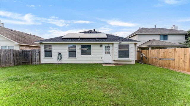 2319 Blue Reef Dr, Katy, TX 77449 - rear view of house with solar panels and a fenced backyard