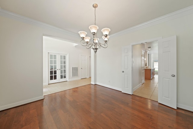 4802 N Pine Brook Way, Houston, TX 77059 - unfurnished dining area featuring crown molding, a chandelier, wood finished floors, and french doors