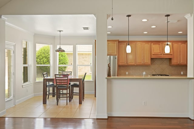 4802 N Pine Brook Way, Houston, TX 77059 - kitchen featuring ornamental molding, light countertops, decorative backsplash, recessed lighting, and light wood-style flooring