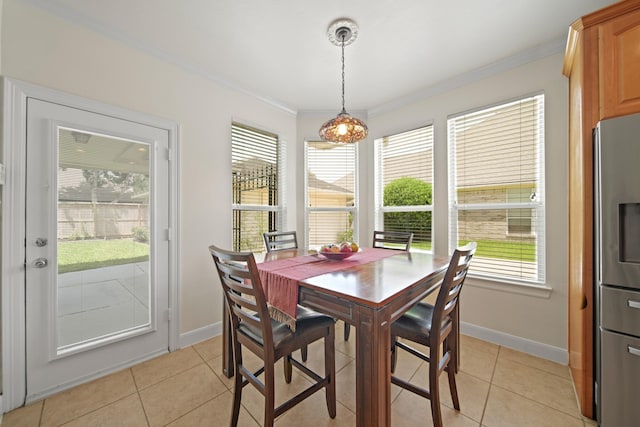 4802 N Pine Brook Way, Houston, TX 77059 - dining space with ornamental molding and light tile patterned floors