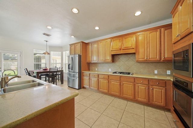 4802 N Pine Brook Way, Houston, TX 77059 - kitchen featuring stainless steel appliances, healthy amount of natural light, backsplash, pendant lighting, and recessed lighting