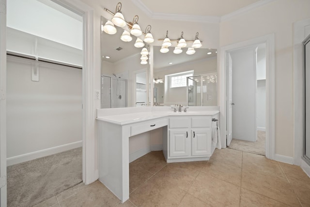 4802 N Pine Brook Way, Houston, TX 77059 - bathroom with a walk in closet, crown molding, a shower stall, vanity, and tile patterned floors