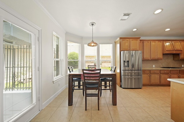 4802 N Pine Brook Way, Houston, TX 77059 - kitchen featuring appliances with stainless steel finishes, crown molding, premium range hood, tasteful backsplash, and light countertops