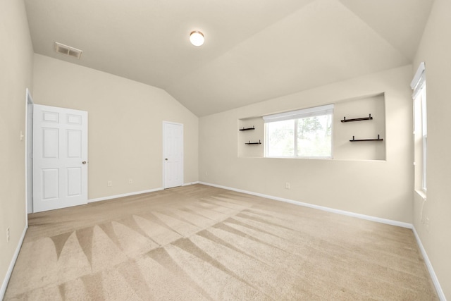 9914 Swallow Dr, Conroe, TX 77385 - unfurnished room featuring vaulted ceiling and light carpet