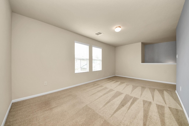 9914 Swallow Dr, Conroe, TX 77385 - spare room featuring light carpet and baseboards