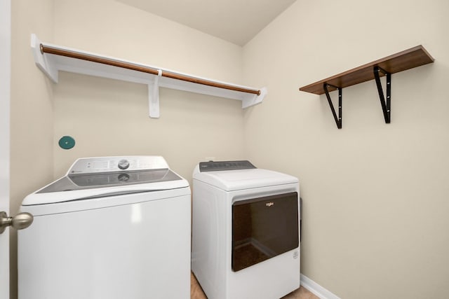 9914 Swallow Dr, Conroe, TX 77385 - washroom featuring washing machine and dryer and baseboards
