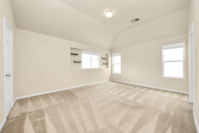 9914 Swallow Dr, Conroe, TX 77385 - unfurnished room featuring light carpet and lofted ceiling