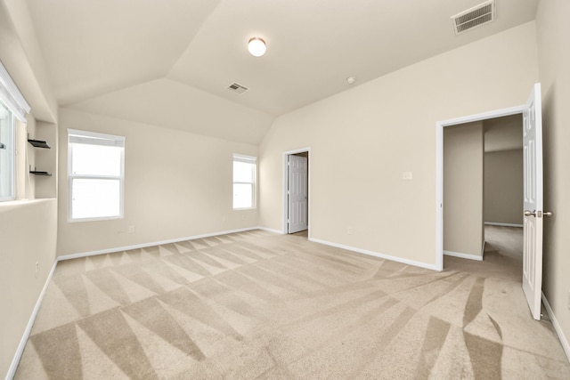 9914 Swallow Dr, Conroe, TX 77385 - unfurnished bedroom featuring light carpet and lofted ceiling