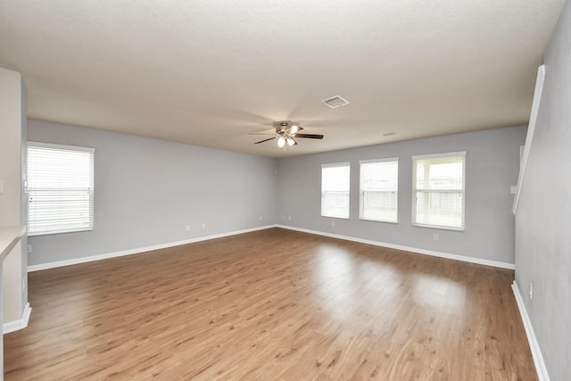 9914 Swallow Dr, Conroe, TX 77385 - empty room with a ceiling fan and wood finished floors
