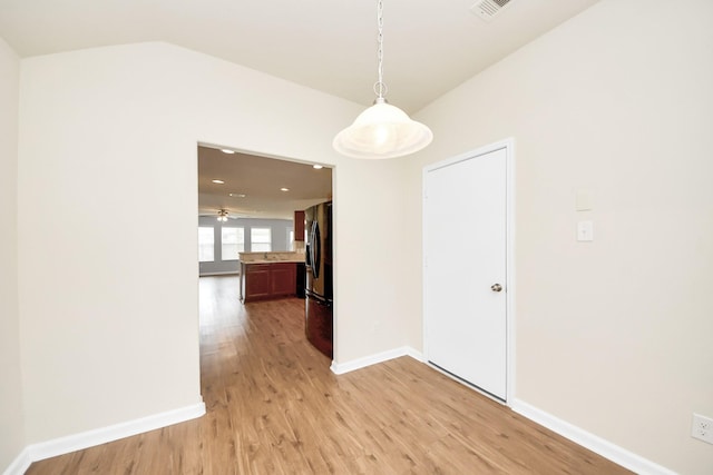 9914 Swallow Dr, Conroe, TX 77385 - unfurnished dining area featuring light wood-style floors, a ceiling fan, and vaulted ceiling
