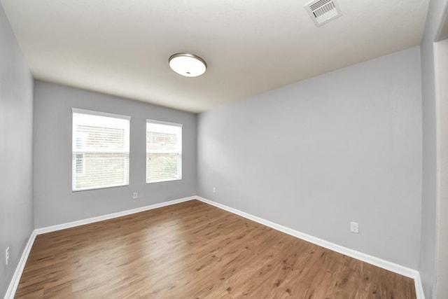 9914 Swallow Dr, Conroe, TX 77385 - unfurnished room featuring wood finished floors and baseboards