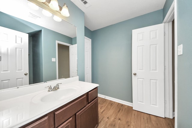 9914 Swallow Dr, Conroe, TX 77385 - bathroom featuring wood finished floors and vanity