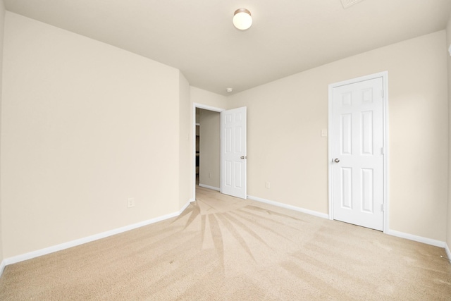9914 Swallow Dr, Conroe, TX 77385 - unfurnished bedroom featuring light carpet and baseboards