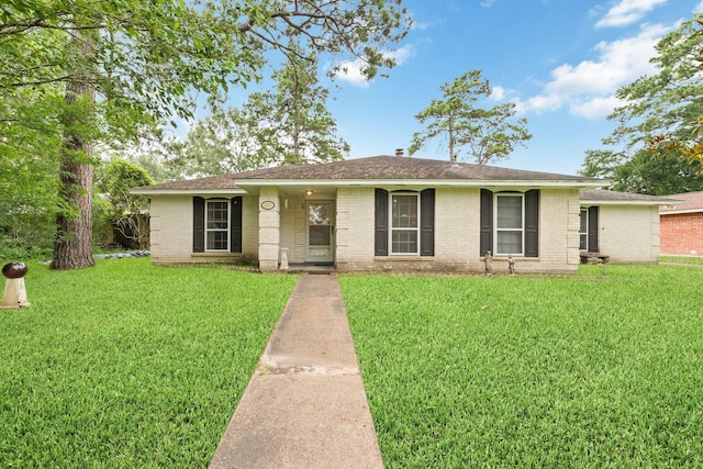 12611 Bexhill Dr, Houston, TX 77065 - ranch-style home with a front yard, brick siding, and a shingled roof